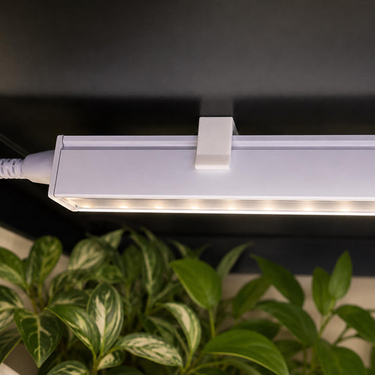 Barrina T5 magnetic light clip installed in IKEA Milsbo plant cabinet – close-up