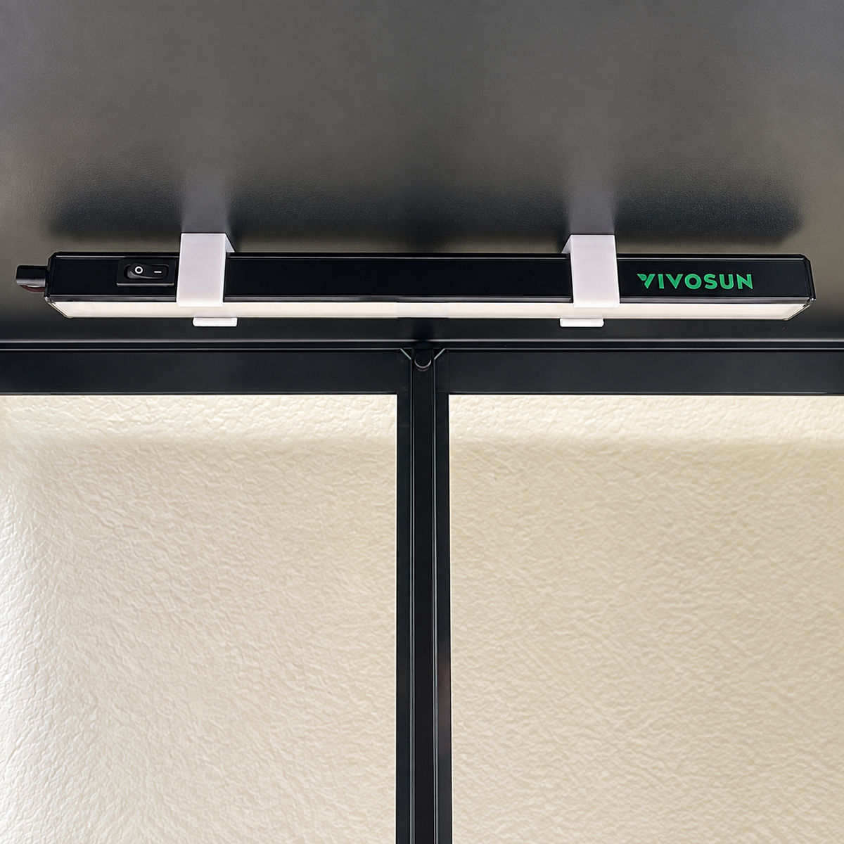 One Vivosun T5 light bar installed under a cabinet shelf with two white magnetic mounts.