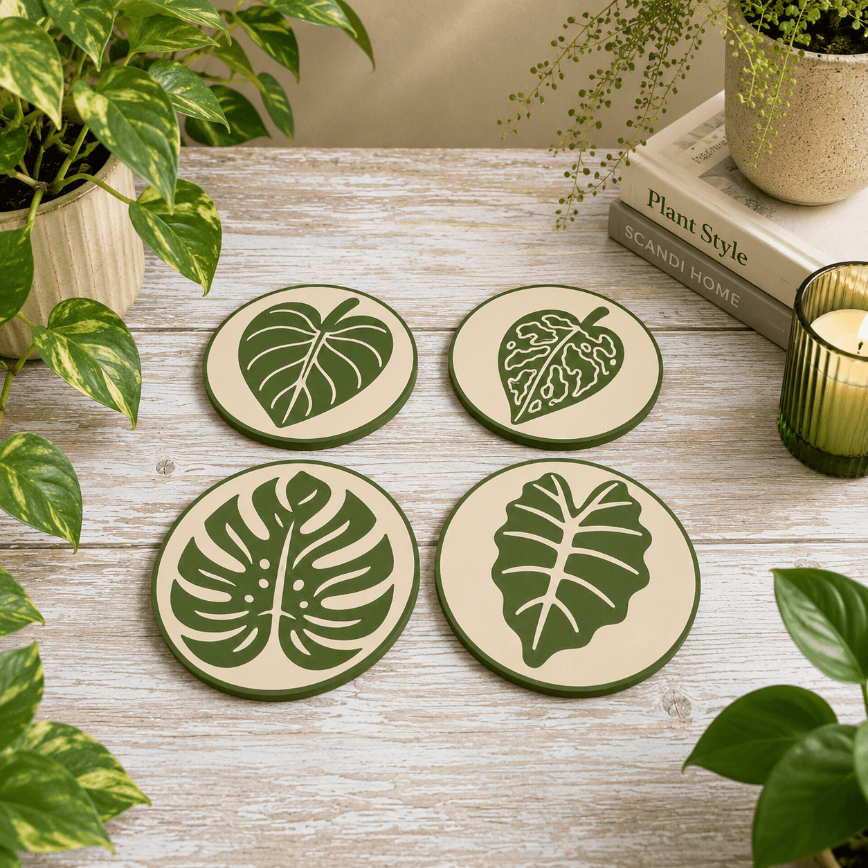 Complete set of four botanical leaf coasters featuring Philodendron, Variegated, Monstera, and Alocasia designs, 3D printed with cork backing