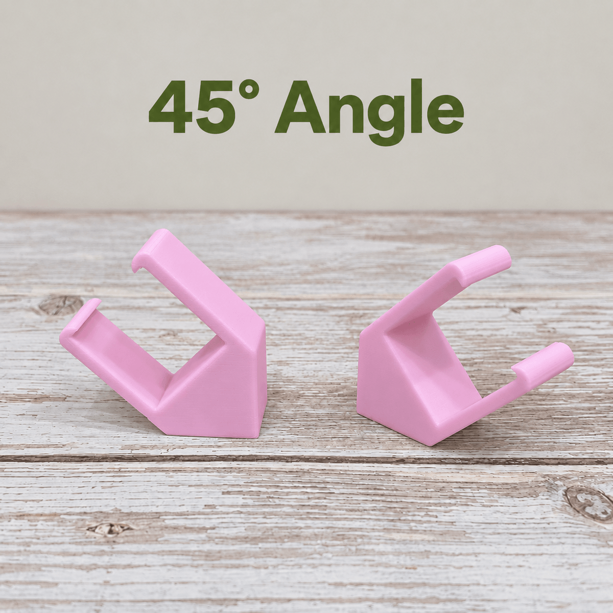 Two pink PETG magnetic mounts for Barrina T5 grow lights on a pale wood surface, labeled 45° Angle.