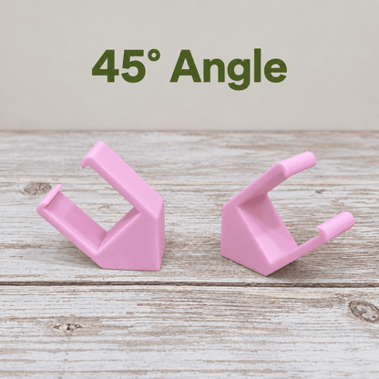 Two pink PETG magnetic mounts for Barrina T5 grow lights on a pale wood surface, labeled 45° Angle.