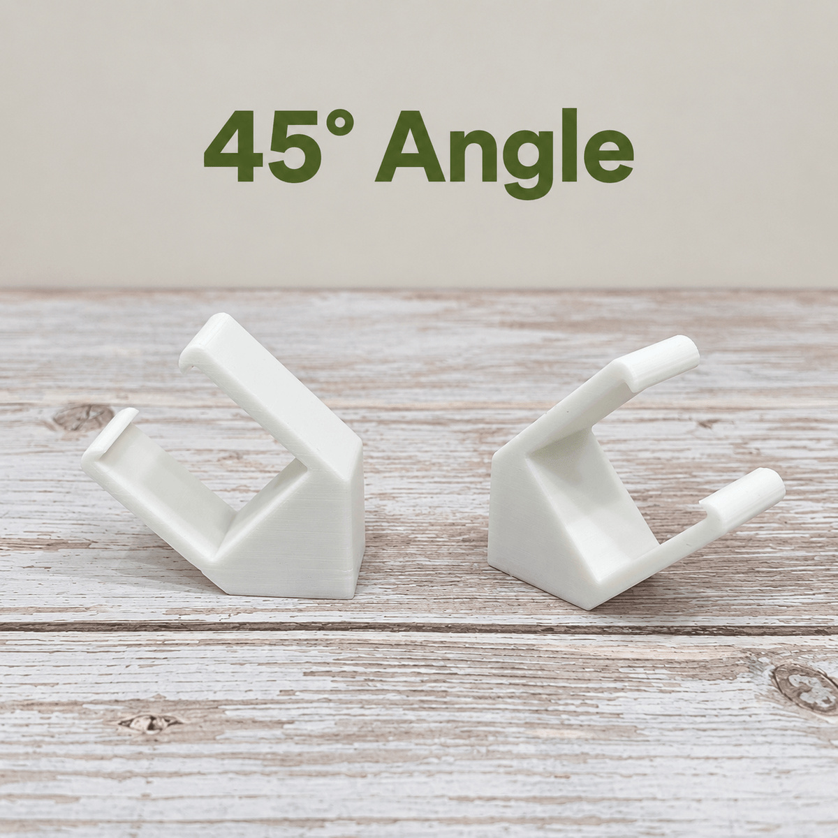 Two white PETG magnetic mounts for Barrina T5 grow lights on a pale wood surface, labeled 45° Angle.