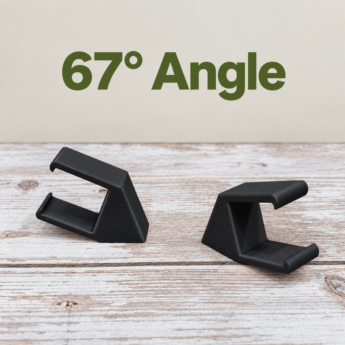 Two black PETG magnetic mounts for Barrina T5 grow lights on a pale wood surface, labeled 67° Angle.