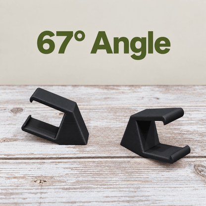 Two black PETG magnetic mounts for Barrina T5 grow lights on a pale wood surface, labeled 67° Angle.