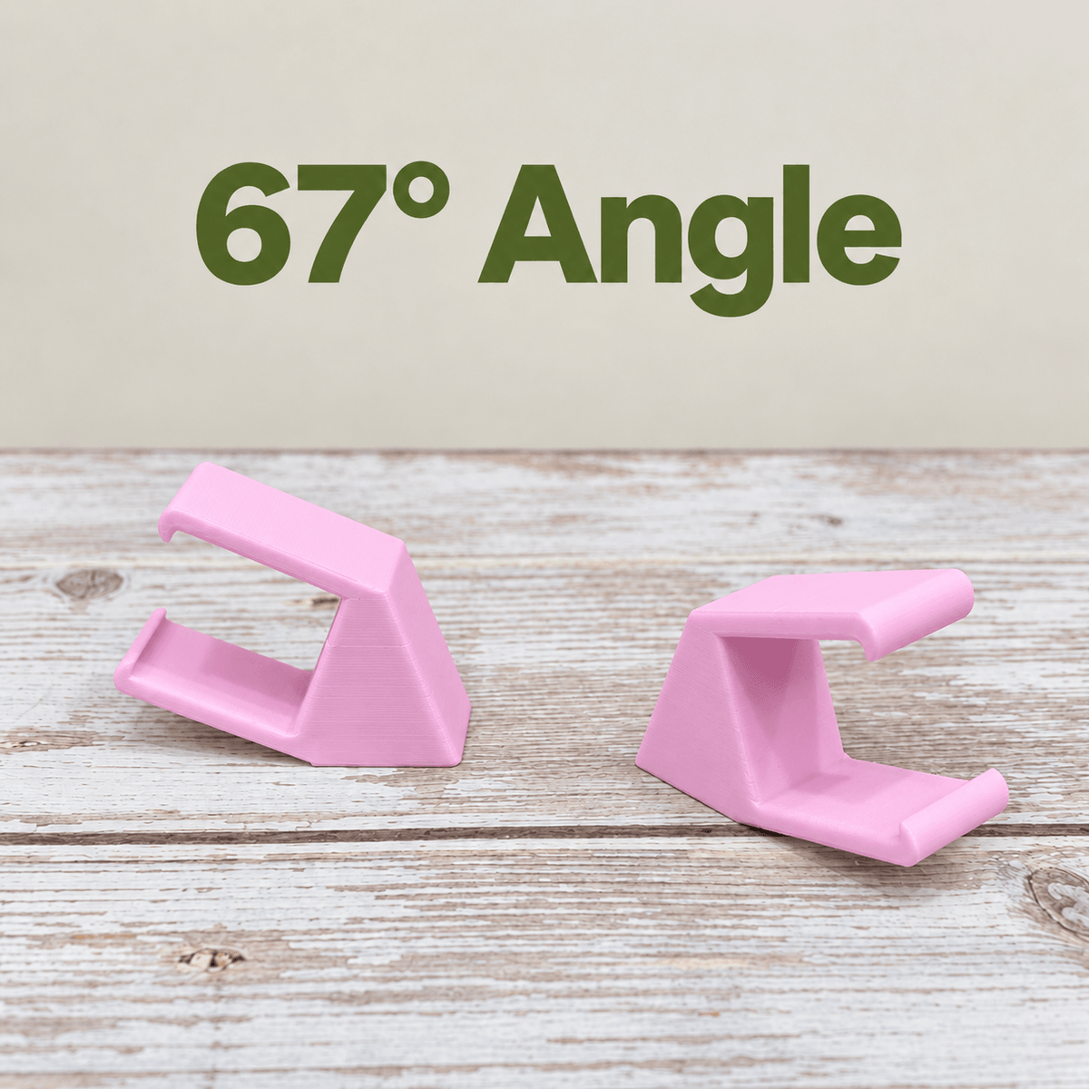 Two pink PETG magnetic mounts for Barrina T5 grow lights on a pale wood surface, labeled 67° Angle.