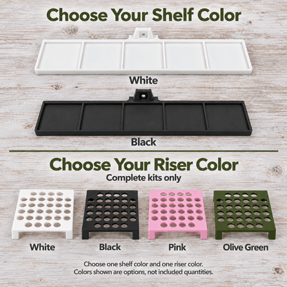 A color selection graphic for a shelf and riser set, showing two long rectangular shelf pieces labeled White and Black, and four smaller riser pieces labeled White, Black, Pink, and Olive Green on a light wood background. Text reads 'Choose Your Shelf Color' and 'Choose Your Riser Color' with a note that colors shown are options, not included quantities.