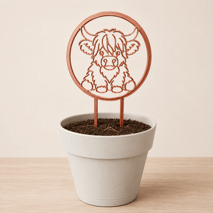 Copper silk Highland cow plant trellis displayed in a decorative pot
