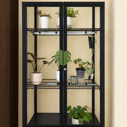 A tall black metal shelving unit with two glass doors, shown holding several potted houseplants. The shelves include wire racks and a solid bottom shelf, set against a beige wall.