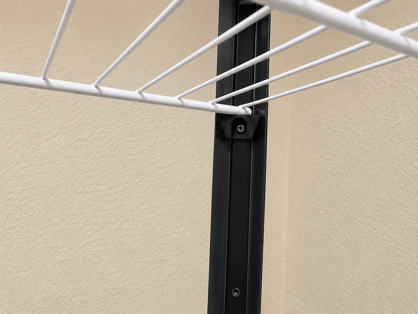 Corner mounting bracket installed for a DIY wire shelf inside an IKEA Milsbo cabinet.