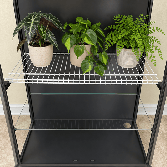 Front view of an IKEA Rudsta cabinet with three potted plants on a white wire shelf supported by two black brackets, above a glass shelf.