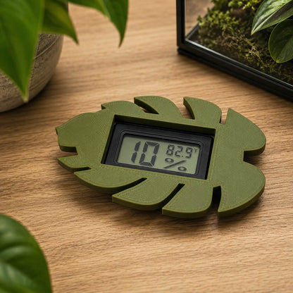 Monstera leaf hygrometer mounted on cabinet glass – WBDesignsLV