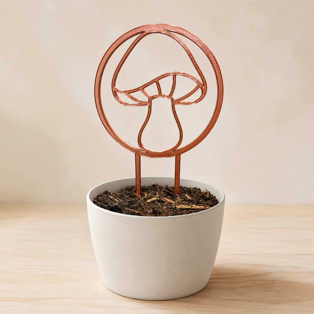 Decorative mushroom plant trellis displayed in an indoor flowerpot