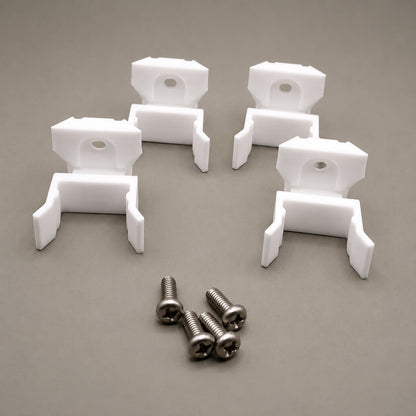 White plastic brackets with screws on a gray background