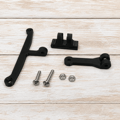 Black metal mounting hardware set including two black brackets, two silver screws, and two silver nuts, arranged on a light wood plank background.